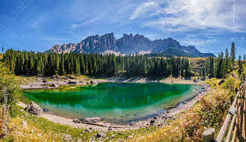 Incredible panoramic view of the Lake Carezza (Italian: Lago di Carezza, German: Karersee), a small alpine lake in the Dolomites in South Tyrol