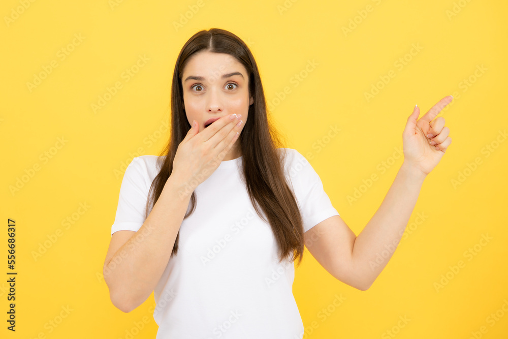 Woman point at copy space, showing copyspace pointing. Promo, girl showing advertisement content gesture, pointing with hand recommend product.