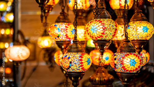 Lighting products sold in Istanbul Grand Bazaar, traditional Turkish lamps, touristic gifts, blurred background with spaces and text space 