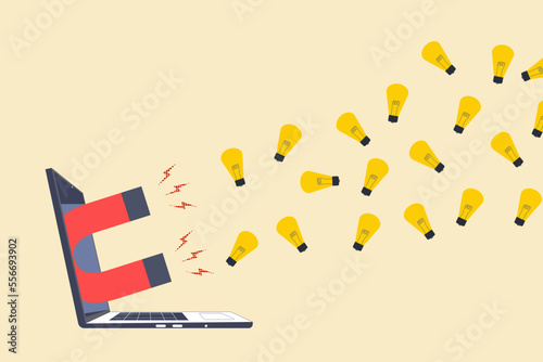 Magnet out from laptop to magnetize light bulb lamp ideas.concept of new ideas, creativity, innovation and opportunity.
