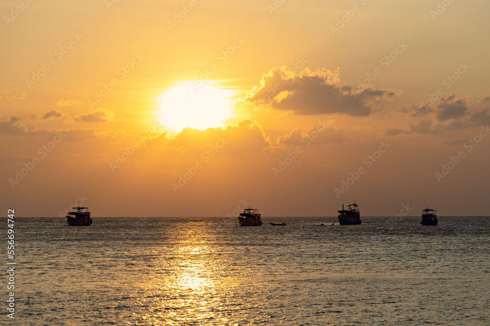 Spectacular sunset with boats in the sea, Koh Tao, Thailand