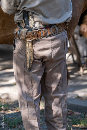 Details of the typical gaucho sash with the facón on it