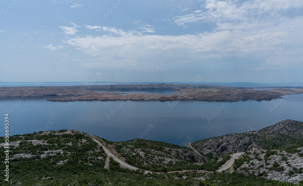 Beautiful Landscape ant Nature. Croatia Mountains with Sea and Road in Background. Cloudy Blue Sky