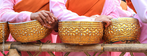 Myanmar nun holding bowl