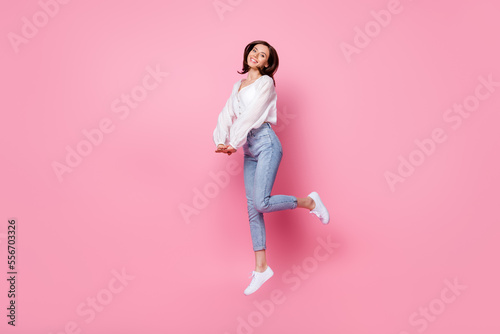 Full length photo of positive adorable lady wear stylish outfit hand together enjoy hobby empty space isolated on pink color background