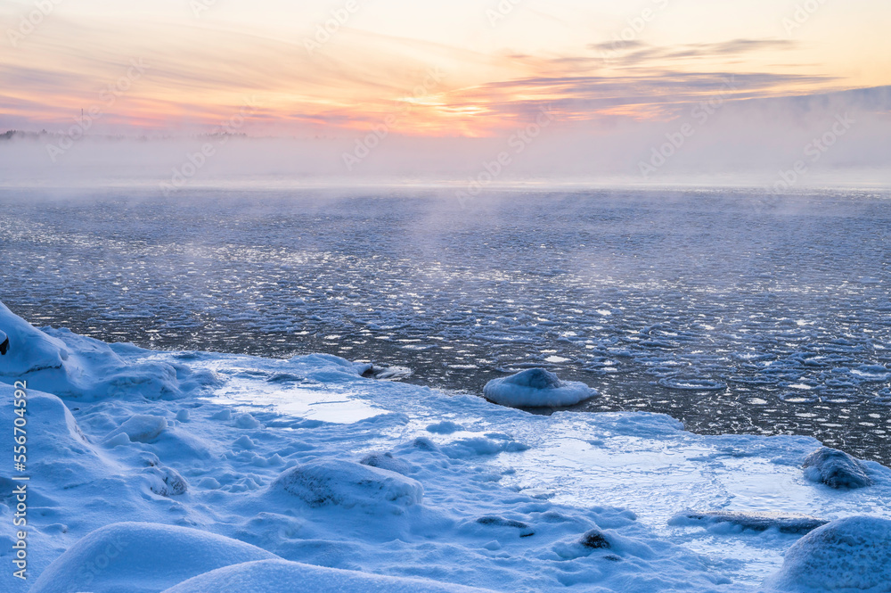 View of the frozen sea and setting sun. Pörkenäs, Jakobstad/Pietarsaari. Finland