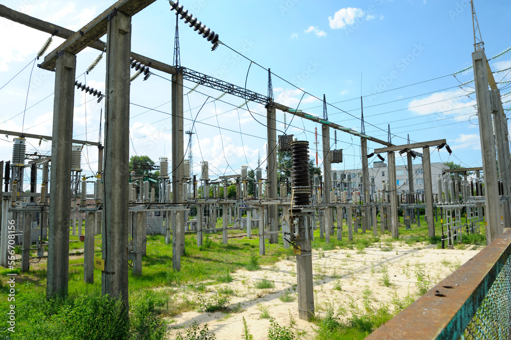 Fototapeta premium power transmission lines of an electrical substation. power line poles, insulators
