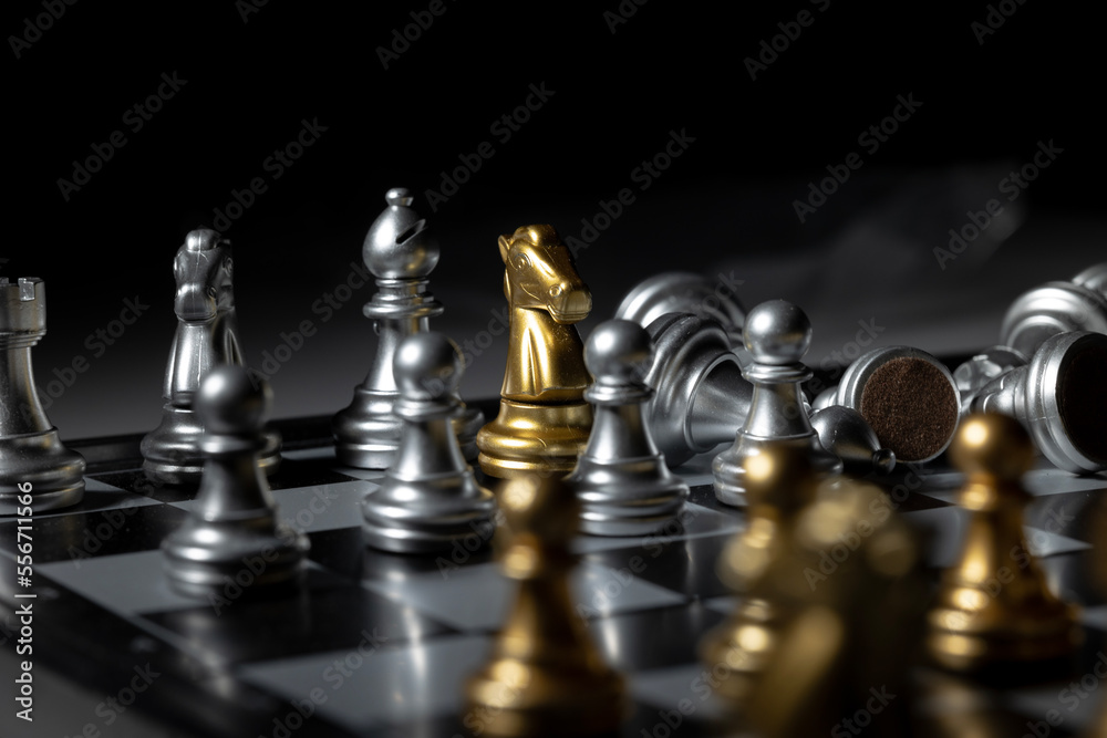 The gold chess on the board is fighting with the opponent. business concept success concept The gold chess on the board is fighting with the opponent. business concept success concept