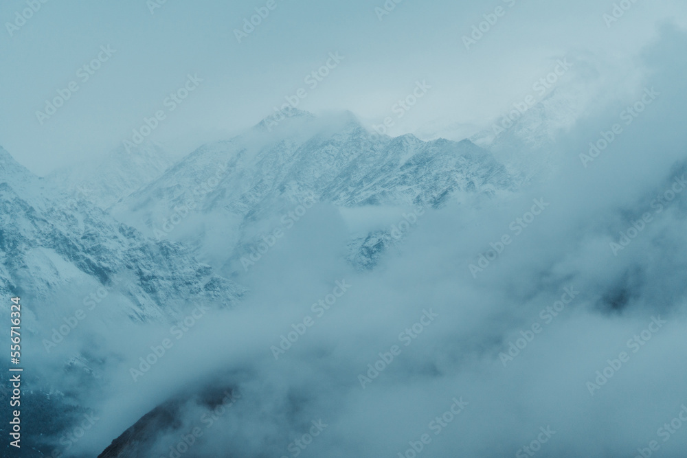 Closeup shot of snow covered Himalayan mountain after the blizzard at Lahaul Spiti in Himachal Pradesh, India. Mountains covered by snow during the winter season. Natural winter background.