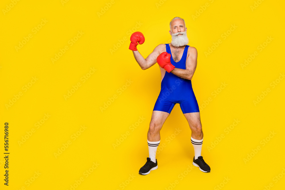 Side profile photo of old aged pensioner wear red boxing gloves opponent versus another opponent empty space isolated on yellow color background
