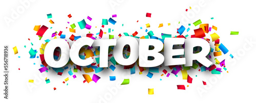 October word over colorful cut out ribbon confetti background.