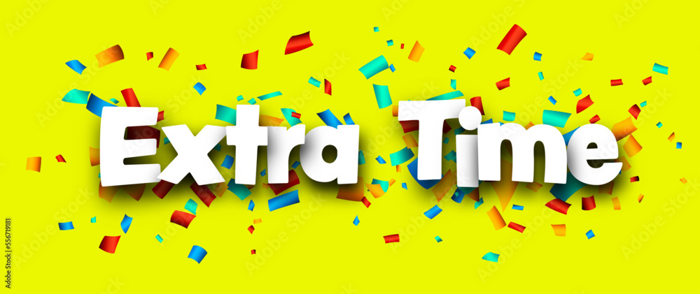 Extra time sign over colorful cut out ribbon confetti background.