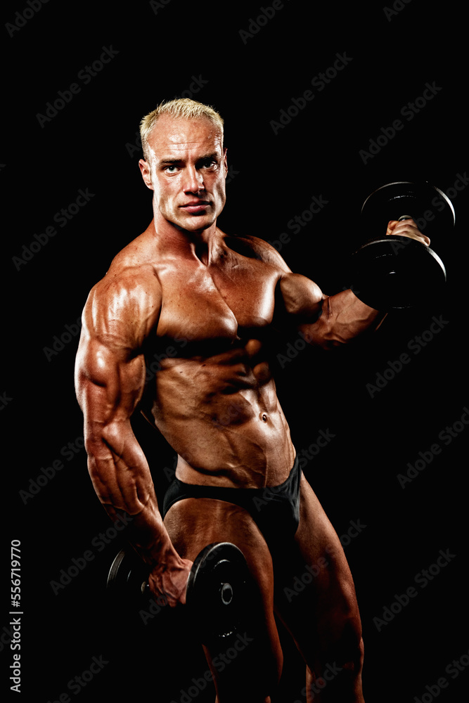 Muscular Man lifting Dumbells 