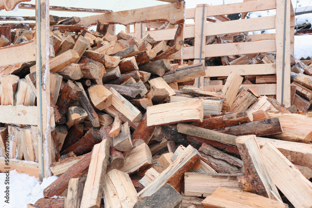 Wooden box with firewood. Chopped and hand-folded in a crate for sale or for storage in a cottage. transport by pallet truck. Wooden box with firewood. Chopped and hand-folded in a crate for sale or for storage in a cottage. transport by pallet truck.