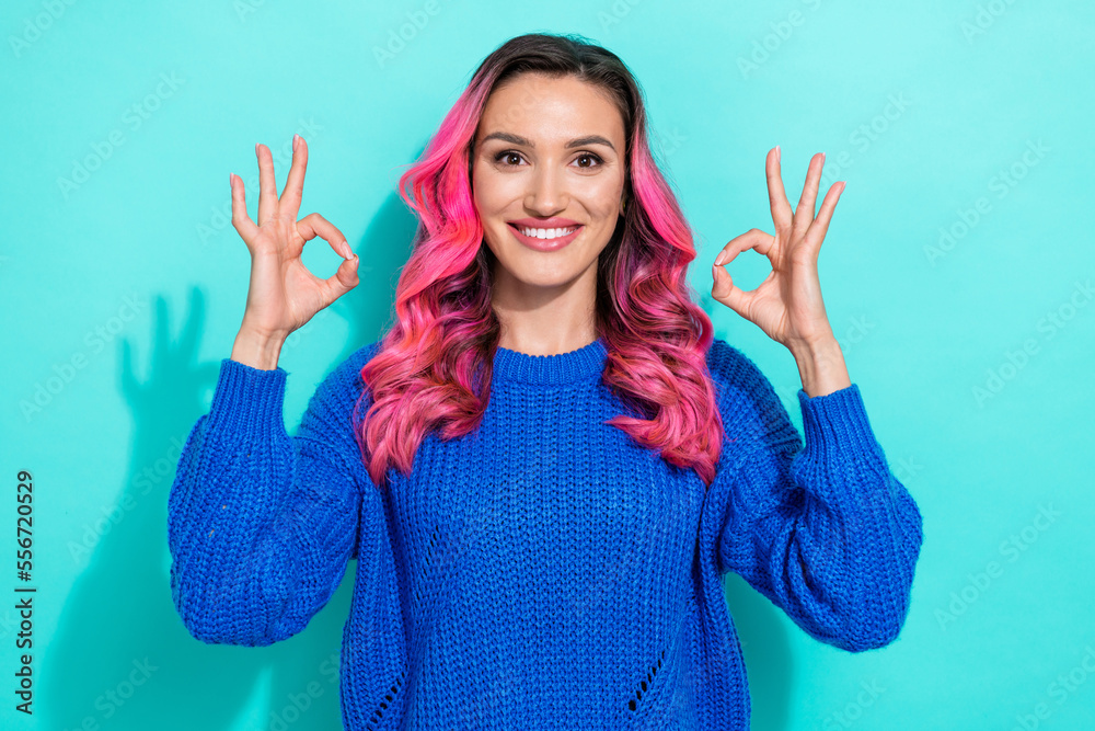 Portrait of cheerful shiny woman with wavy hairstyle wear knit pullover hands showing okey isolated on vivid teal color background Portrait of cheerful shiny woman with wavy hairstyle wear knit pullover hands showing okey isolated on vivid teal color background