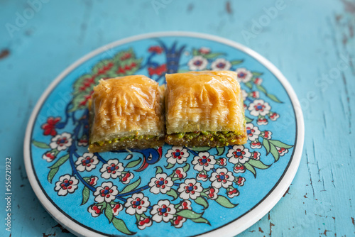 Photograph of Turkish Baklava in Ottoman Tile Turkish Coffee Cup and Turkish Tea Concept, Uskudar Istanbul, Turkey photo