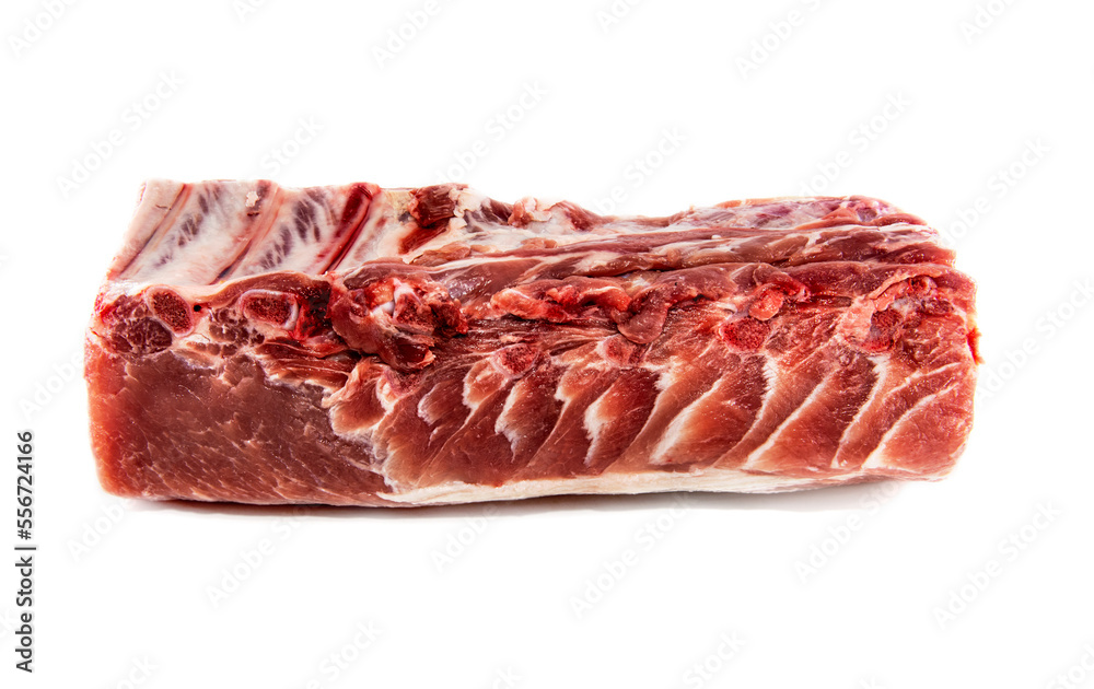 A piece of raw beef or pork meat on a white background. Raw meat with ribs and bones