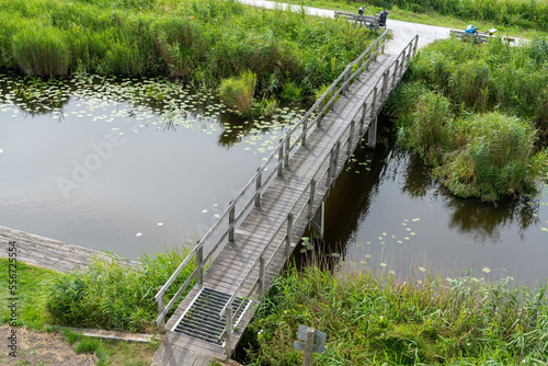 View over bridge from Romsich (wideview) viewing platform in Earnewald in Fryslan (Friesland, The Netherlands) a national park with water, marshes and peatland. photo