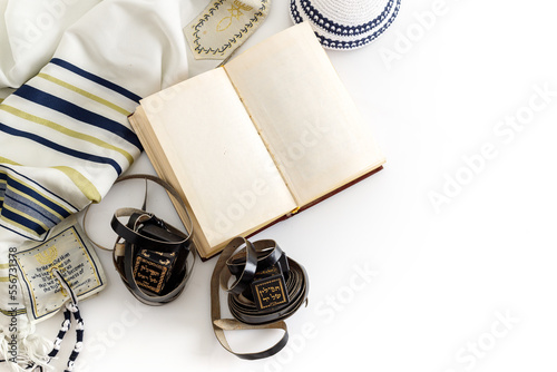Tallit and tefillin and jewish Kippah yarmulke (hat)  on white background photo