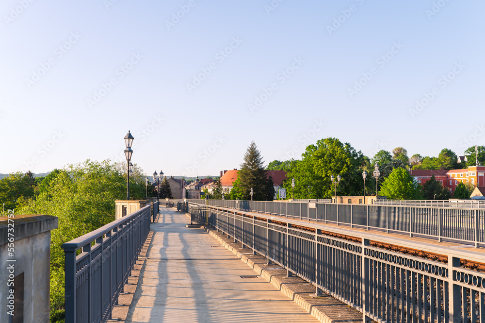 pedestrian walkway next to train railway in city Pirna in Germany