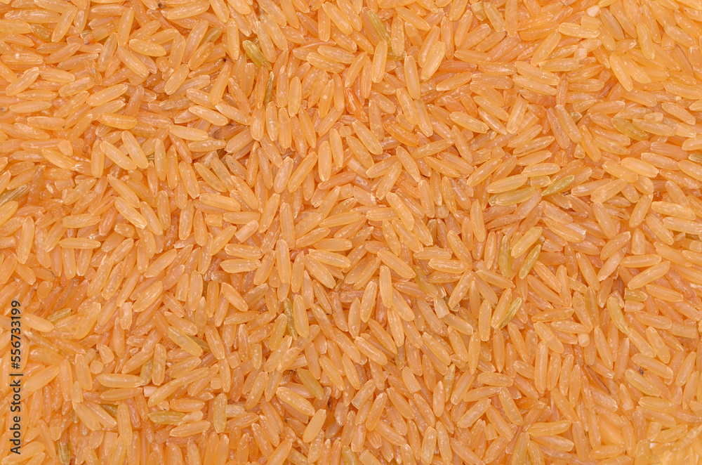 heap of bronze rice isolated on white background