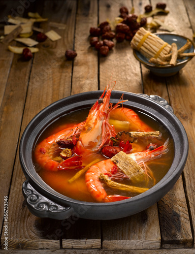 Live Prawn with Herbal Soup and Chinese Wine served in dish isolated on table top view of food