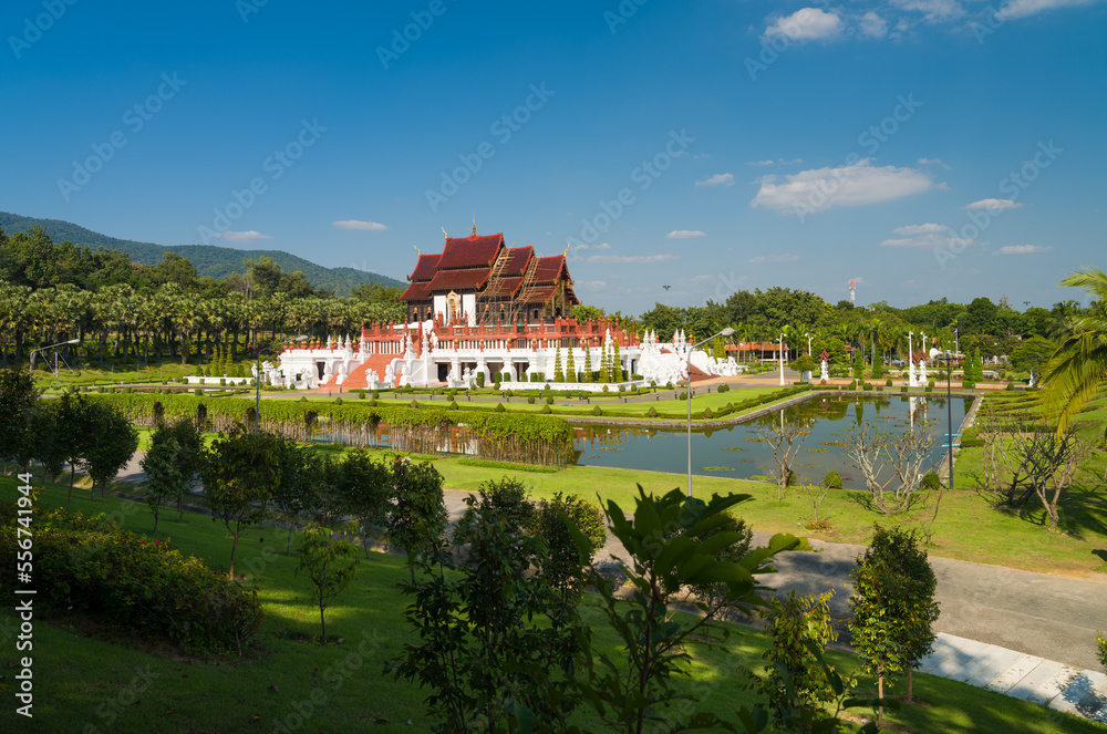 Obraz premium Beautiful day at Royal Flora Ratchaphruek Park. The temple of Grand Pavilion (Hor Kam Luang). Chiang Mai, Thailand