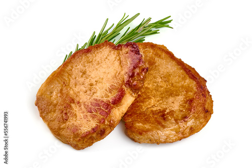 Fried juicy pork steak with rosemary, fried meat, isolated on white background.