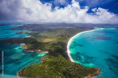 Aerial views over the Whitsunday Island chain. Whitehaven Beach is one of the most popular stops due to it's pure white silica beaches; Whitsundays, Queensland, Australia photo