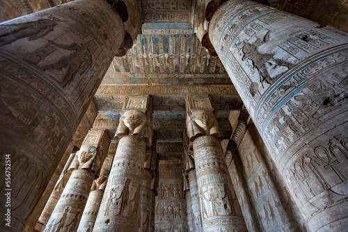 Stone columns and ceiling displaying hieroglyphic carvings at the Hathor Temple, Dendera, Egypt photo