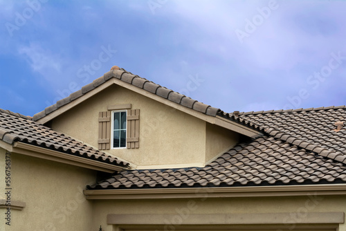 Tiled roof and attic window of a single-family residence, Oasis Community, Menifee, California, USA
