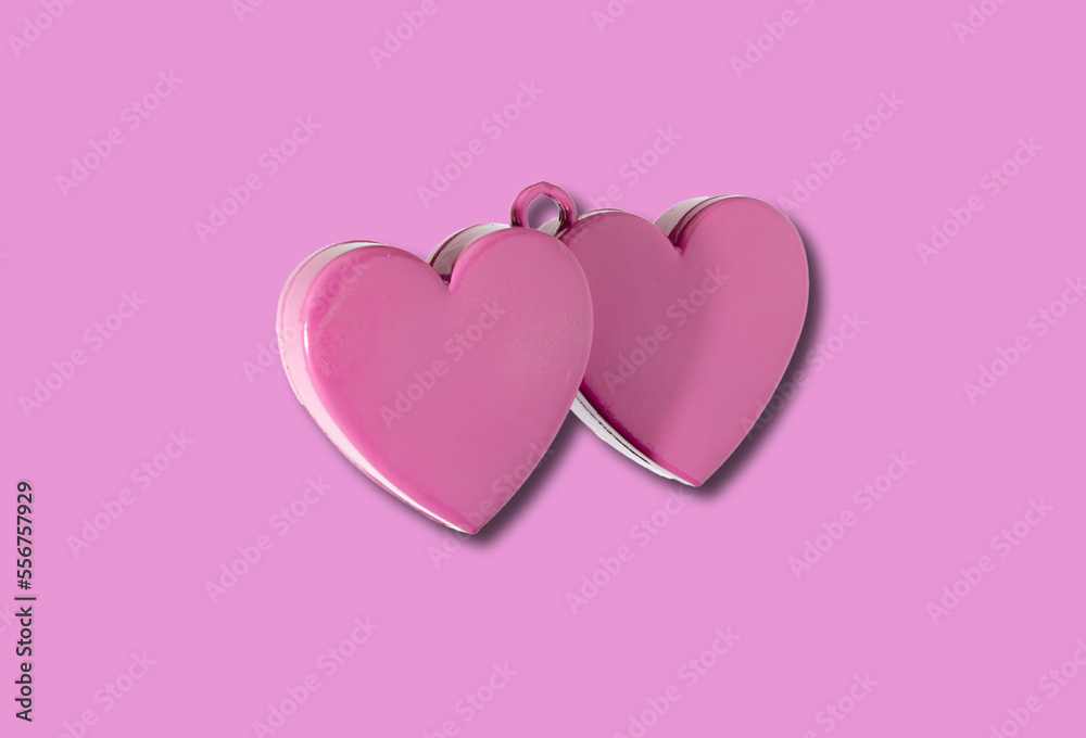 pink double heart on pink background, creative holiday concept
