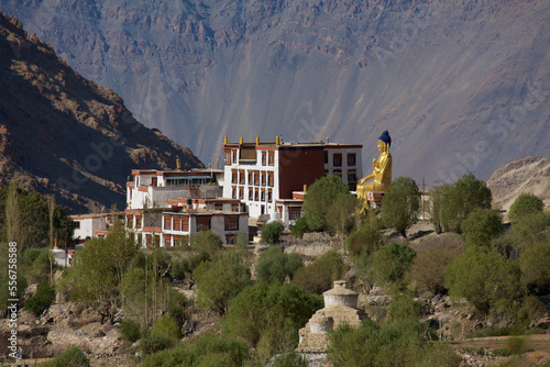 Giant gold plated statue of a seated Buddha at Likir Monastery above the Indus Valley in the Himalayan Mountains of Ladakh, Jammu and Kashmir; Likir, Ladakh, India photo