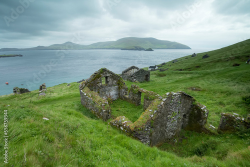 Stone ruins of the deserted village on Great Blasket Island (famous for 19th and 20th Century Irish Language Memoirs); Blasket Islands, County Kerry, Ireland photo