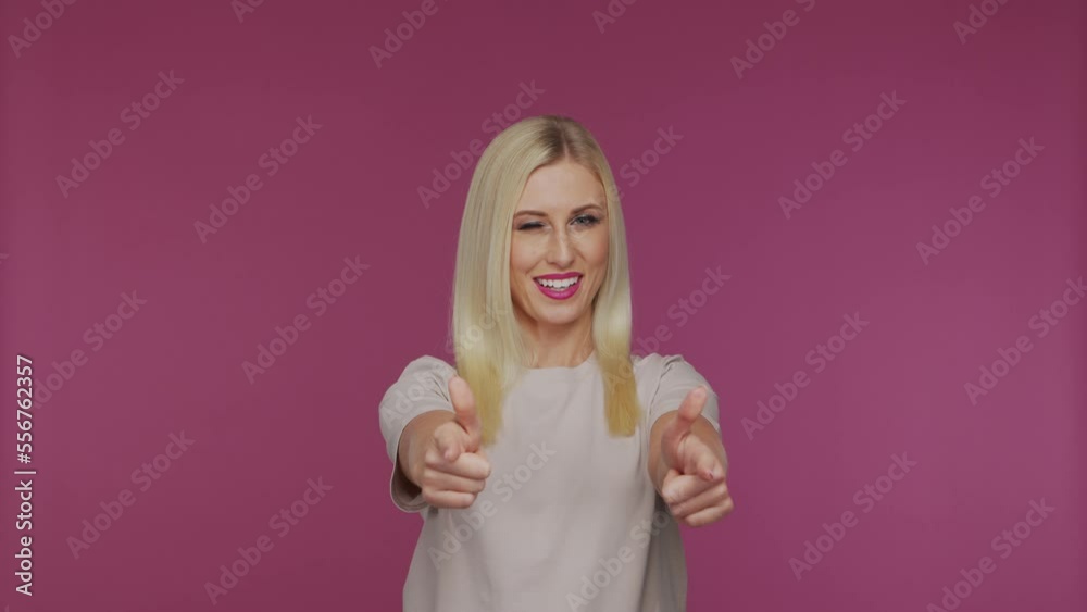Young beautiful blond girl in the studio. Portrait of emotional girl on blue background. Young beautiful blond girl in the studio. Portrait of emotional girl on blue background.