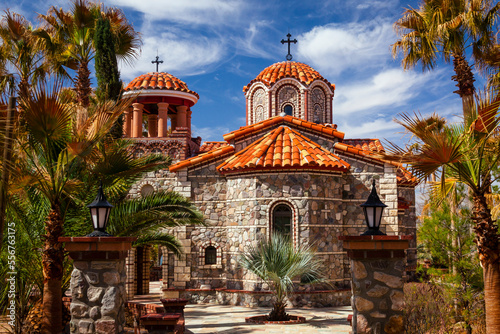 The ornate clay tiled domes and stone exterior of The Chapel of St Nicholas at St Anthony's Greek Orthodox Monastery; Florence, Arizona, United States of America photo