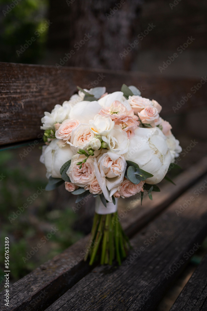 The bride's bouquet of pink peonies on dark backround.