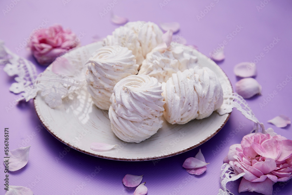 Natural homemade vanilla no sugar marshmallows on purple background. Healthy sweets, natural food. Romantic tea rose decorations. Valentines day present.