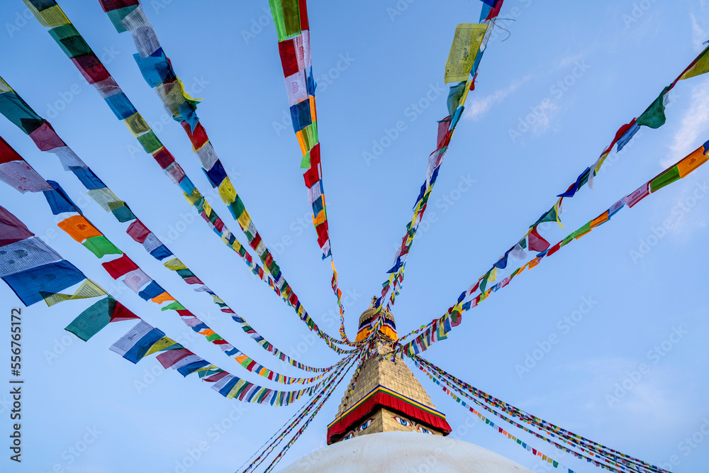 Prayer flags hanging from the spire of the largest Tibetan Buddhist ...