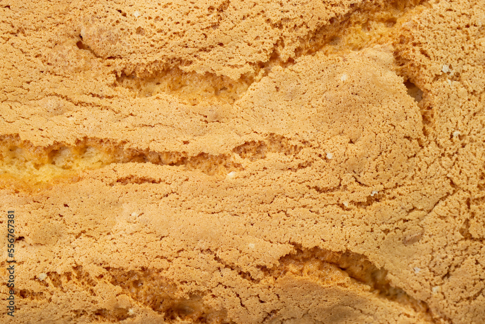 sponge cake crust texture with cracks, soft focus sponge cake crust texture with cracks, soft focus