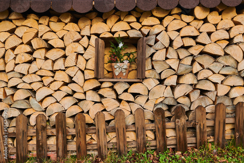 Decorated window in a wood pile at Mount Vapec, Klein Fatra, Carpathian Mountains; Horna Poruba, Slovakia photo