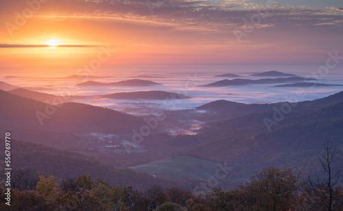 Autumn morning mist shrouds the Shenandoah Mountains in the Blue Ridge Mountains of Virginia. photo