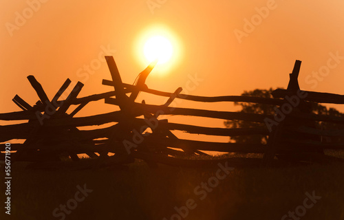 Sunrises over a civil war fence at Henry Hill, Manassas National Battlefield. photo