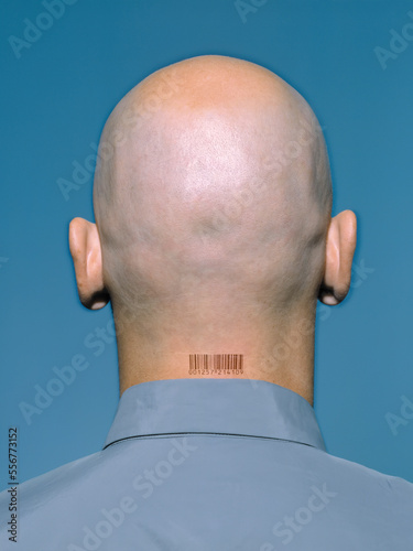 Man with barcode on the back of the neck, symbolizing human surveillance; Studio photo