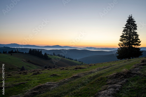Dawn over the Carpathian Mountains near Tasuleasa Social NGO headquarters for the Via Transilvanica trail through Transylvania, Romania; Transylvania, Romania photo