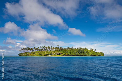 Small tropical island in the Solomon Sea off Kitava in the Trobriand Islands, Papua New Guinea; Kitava Island, Trobriand Islands, Papua New Guinea photo