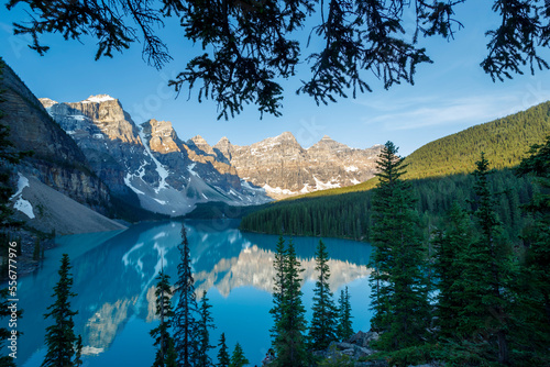 Valley of the Ten Peaks reflected in the tranquil water of Moraine Lake under a bright blue sky in Banff National Park; Alberta, Canada