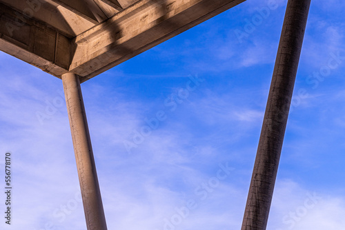 Concrete structure forming various straight geometric lines, in contrast to the blue sky in the background