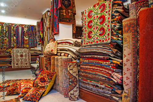 Rugs for sale at a shop in Bodrum, Turkey.; Inside a Turkish carpet shop, in Bodrum, western Anatolia, Turkey. photo