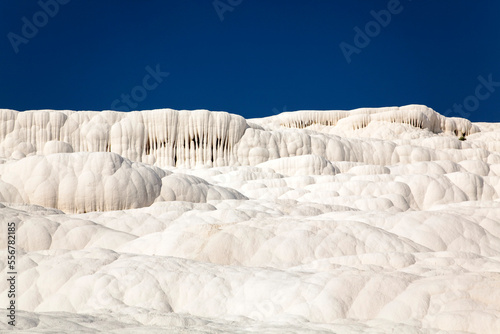 Calcium carbonate travertines at Pamukkale, Turkey, a Unesco World Heritage Site; Pamukkale, Denizli Province, Turkey photo